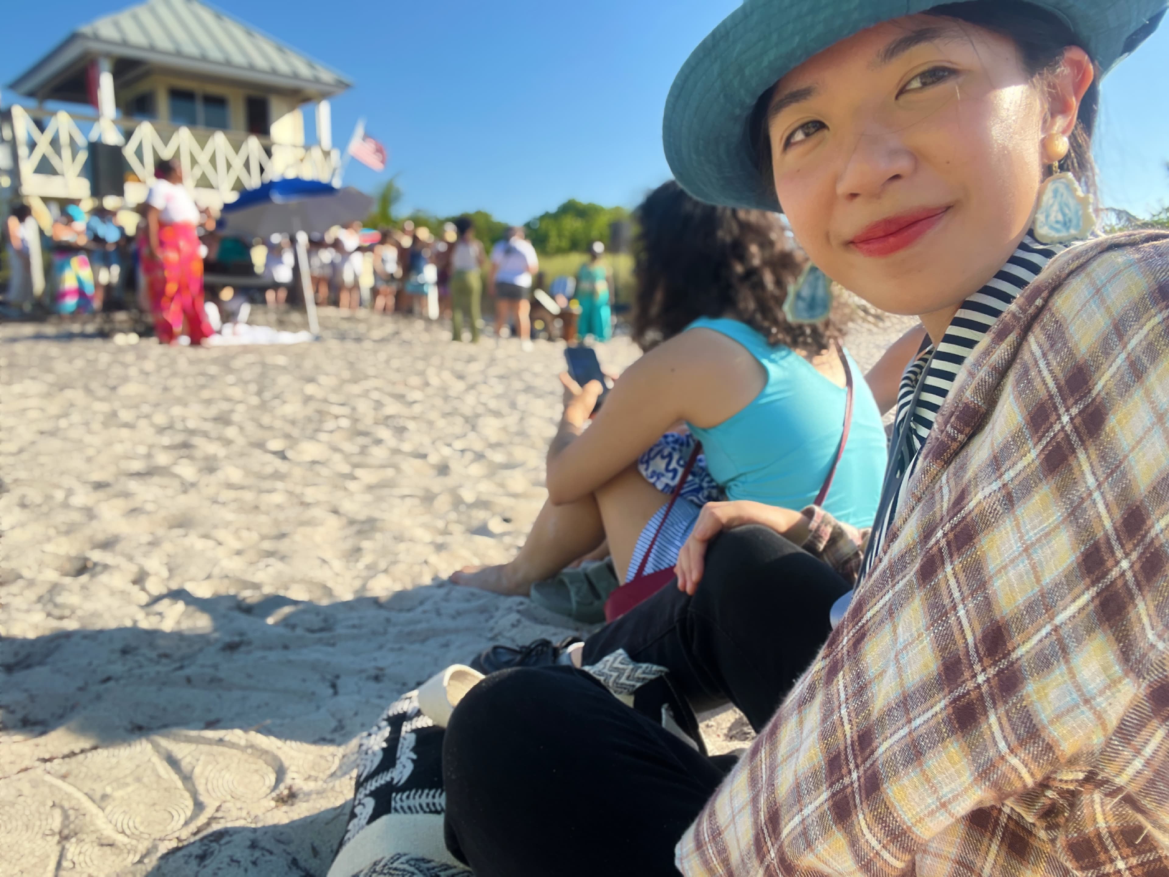 Yuxin Lin at a public beach event during Miami fieldwork.
